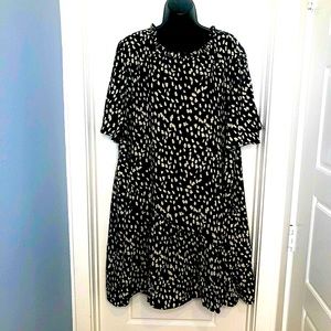 Beautiful A-line black/white print dress. Ruffled neckline and hem. never worn